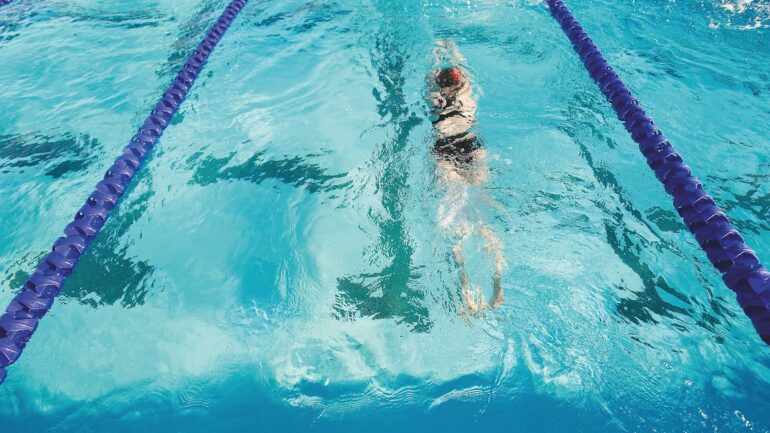 Strawberry Seals swim league, swimmer in the water swimming