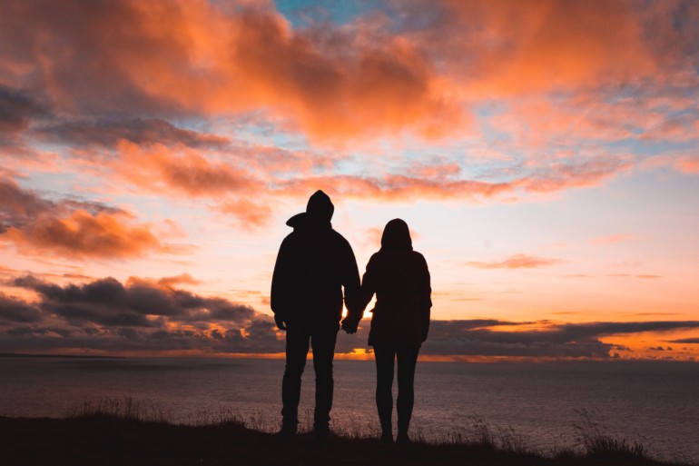 Innovation Match couple dating, holding hands with sunset