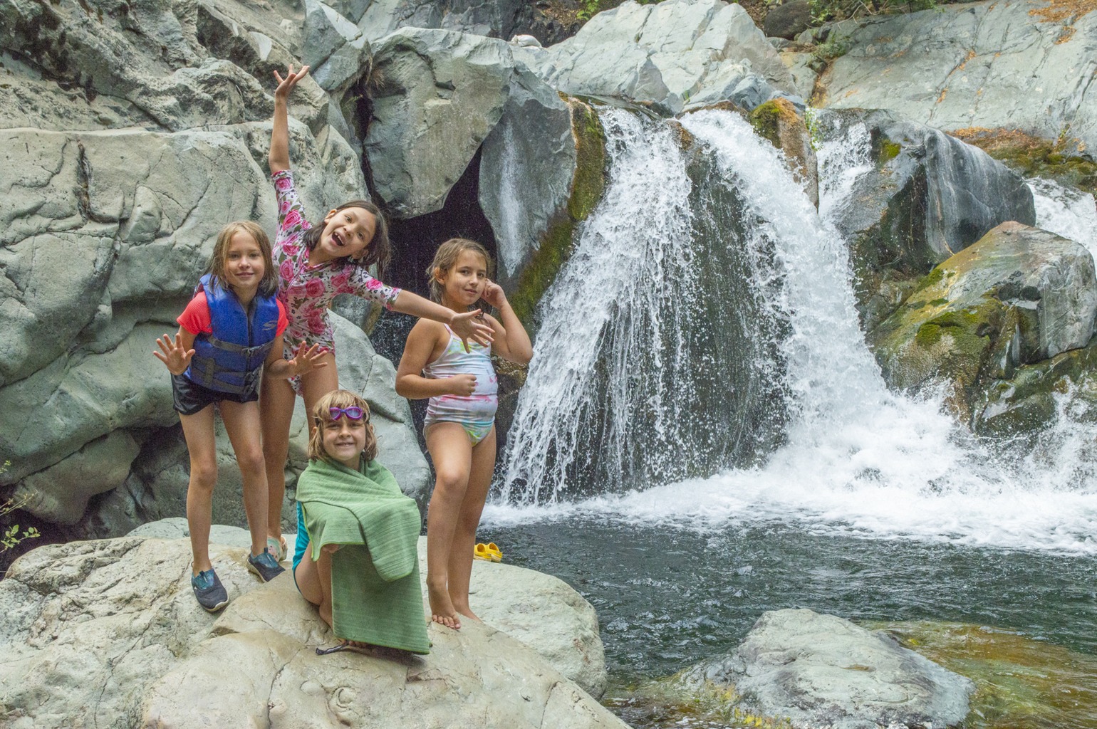 kids near a waterfall