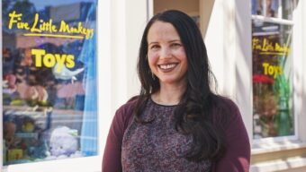 owner in front of her store, five little monkeys