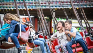 Kids on swings at the Sonoma-Marin Fair