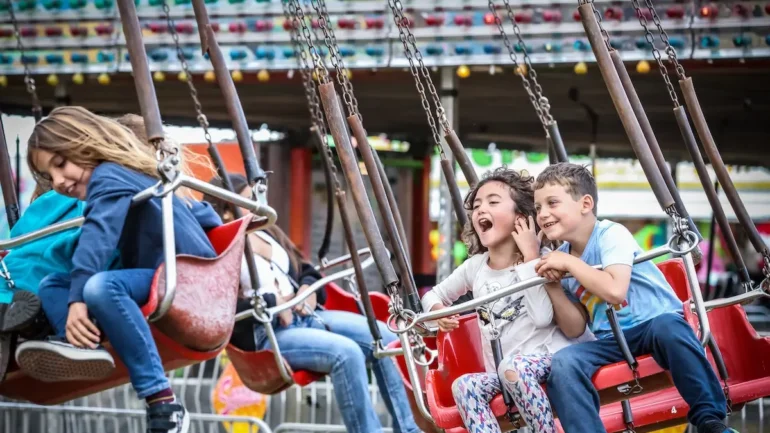 Kids on swings at the Sonoma-Marin Fair