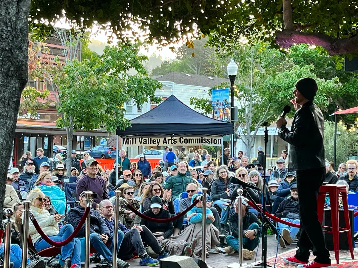 Comedian on stage at June event Comedy in the Plaza in Mill Valley