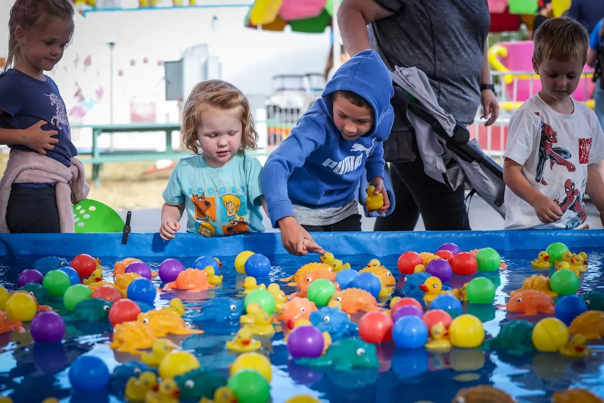 Kids play carnival game at the Sonoma-Marin Fair, a summer June event in Petaluma