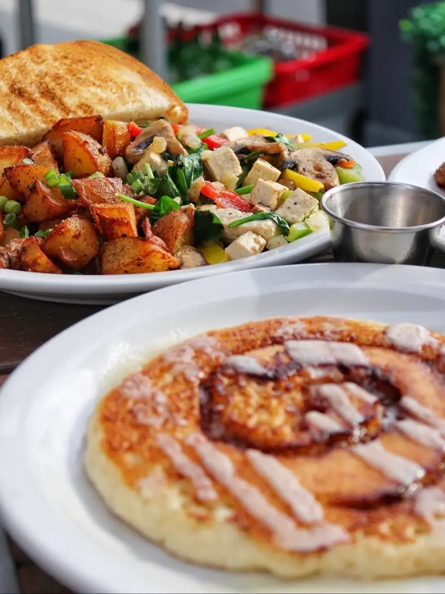Breakfast potatoes, toast and cinnamon roll from Miracle Mile Cafe in San Rafael, California
