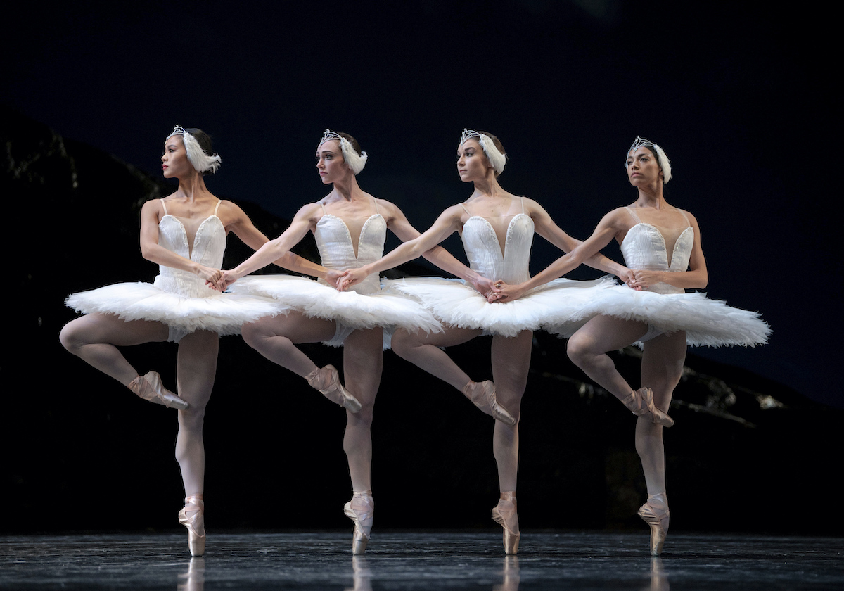 Ballerinas stand in line, performing Swan Lake at San Francisco Ballet.