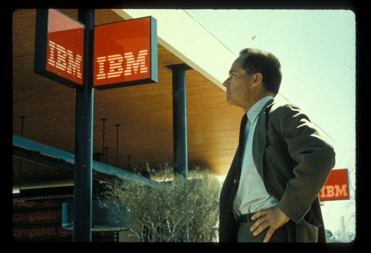 A man stands in front of IBM building, a still from an independent film at SF Indie Film Fest