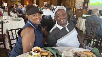 Couple at Side by Side Golf Tournament