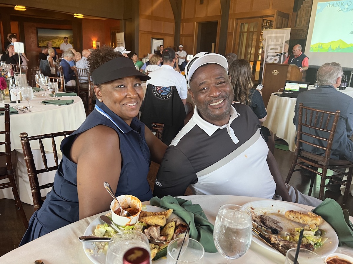Couple at Side by Side Golf Tournament