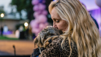 Woman with dog at Marin Humane's Tails by Twilight