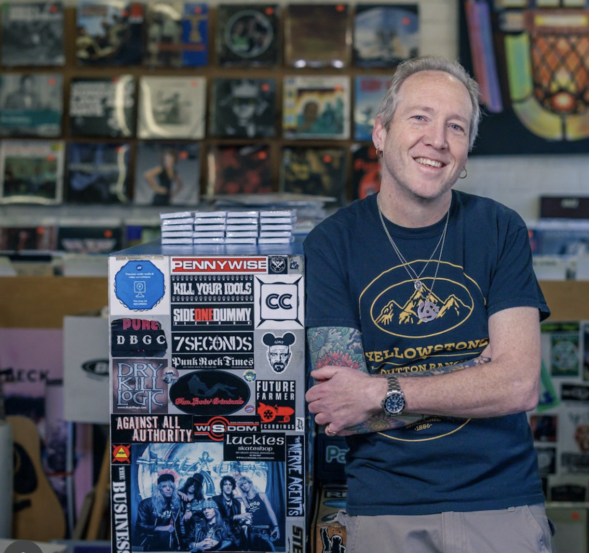 Ken Watts stands in his downtown Novato record store, Watts Music