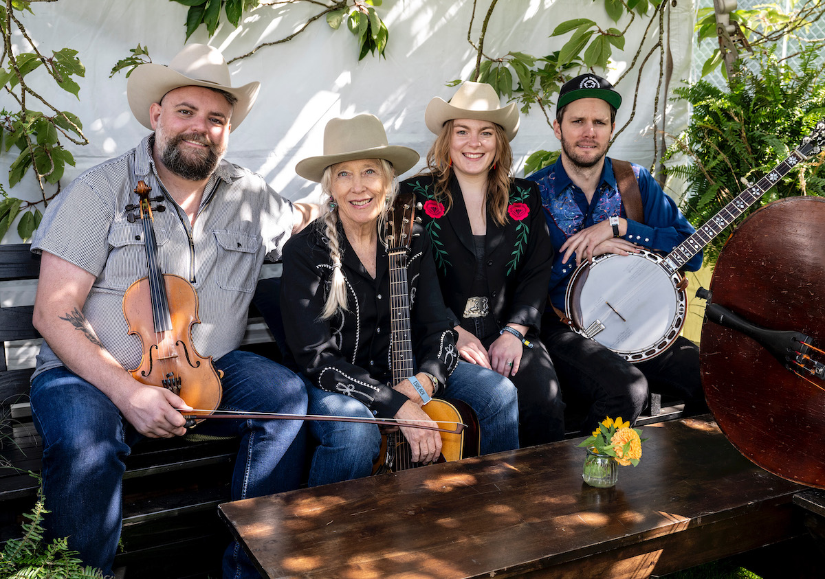 Laurie Lewis sits with her band, THe Right Hands