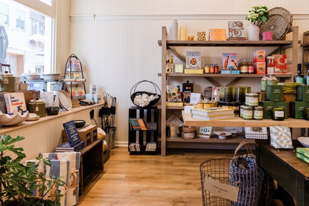 A shop with a large shelf filled with miscellaneous things.