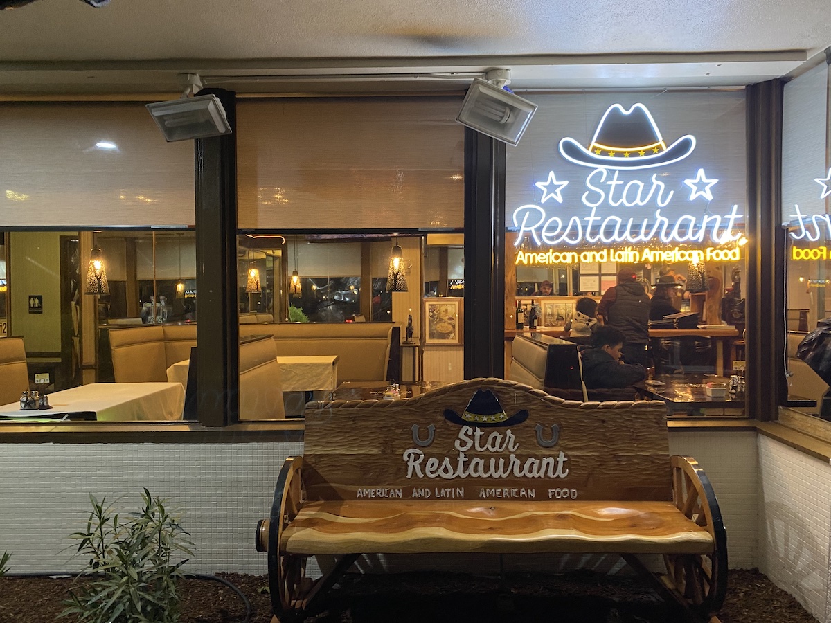 The facade of Star Restaurant in Novato, California, with neon sign in window. 