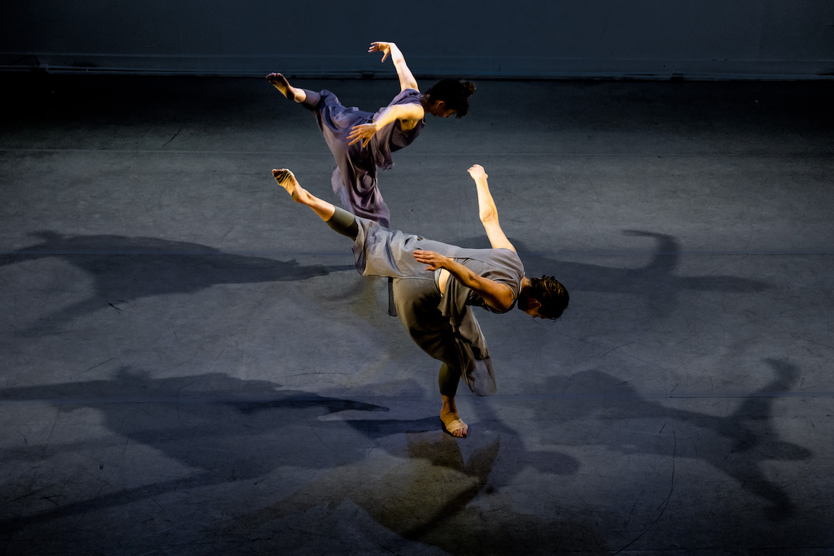 Two dancers in contemporary ensemble seen from above for Nancy Karp + Dancers show in April