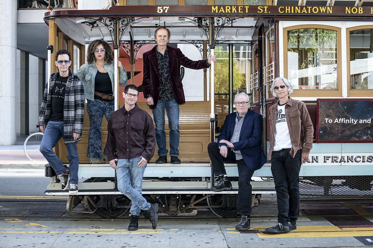 Bay Area-based Wreckless Strangers band posing on San Francisco cable car