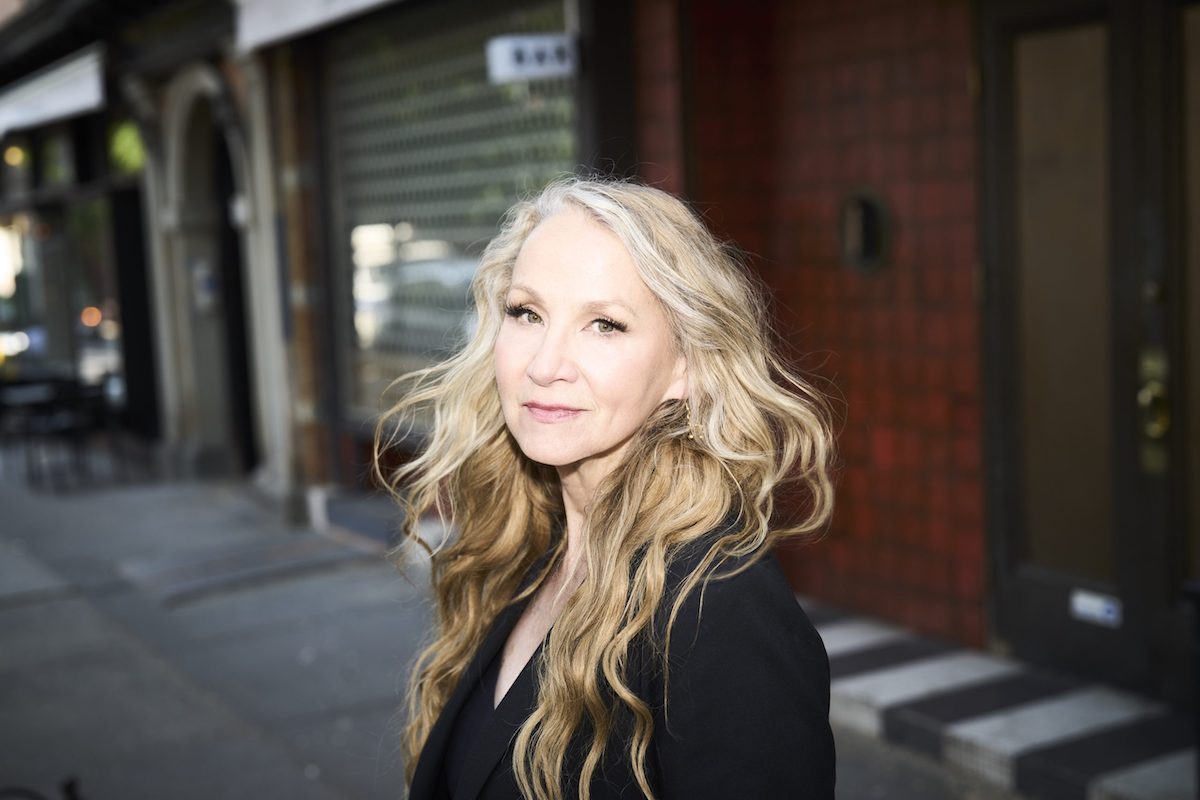 Headshot of Joan Osborne, posing for promotion of her April concert at Sweetwater Music Hall
