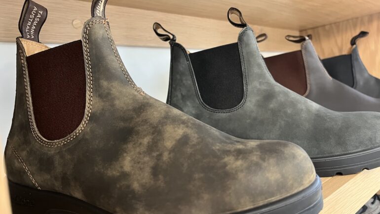 A row of boots on a shelf at Lark Shoes