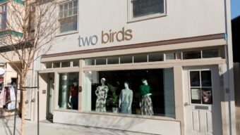 Facade of Two Birds store in Larkspur, with styled mannequins in the window