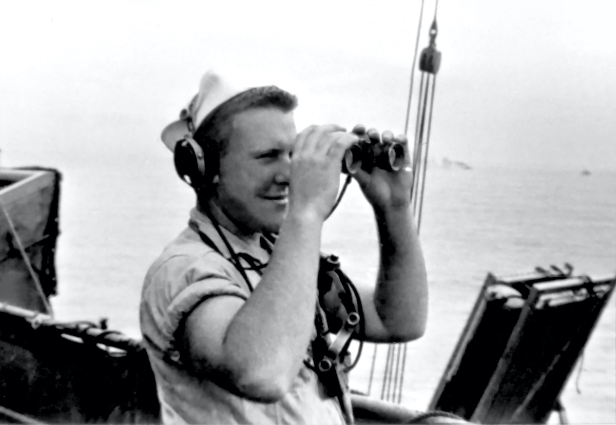 Sailor looks through binoculars during World War 2 on the Jeremiah O'Brien