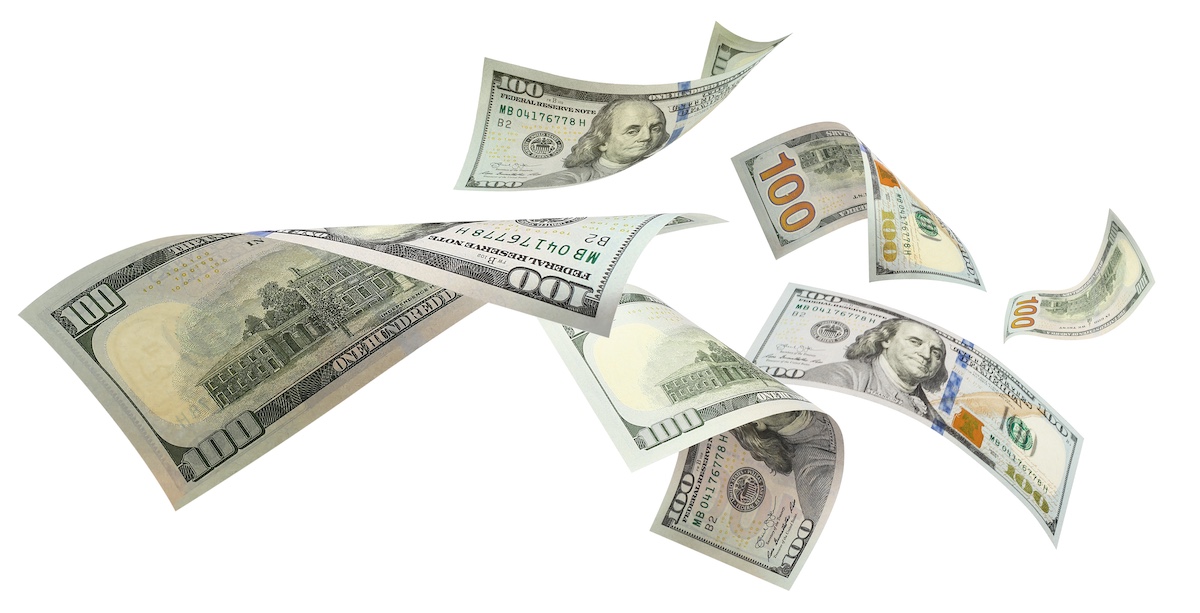 Flying 100 American dollars banknotes, isolated on white background