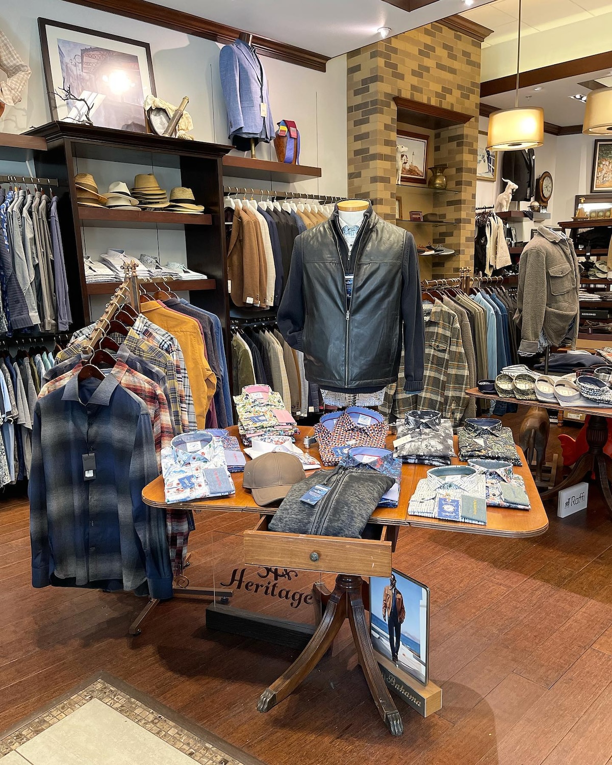 Table of merchandise inside of Louis Thomas menswear store.