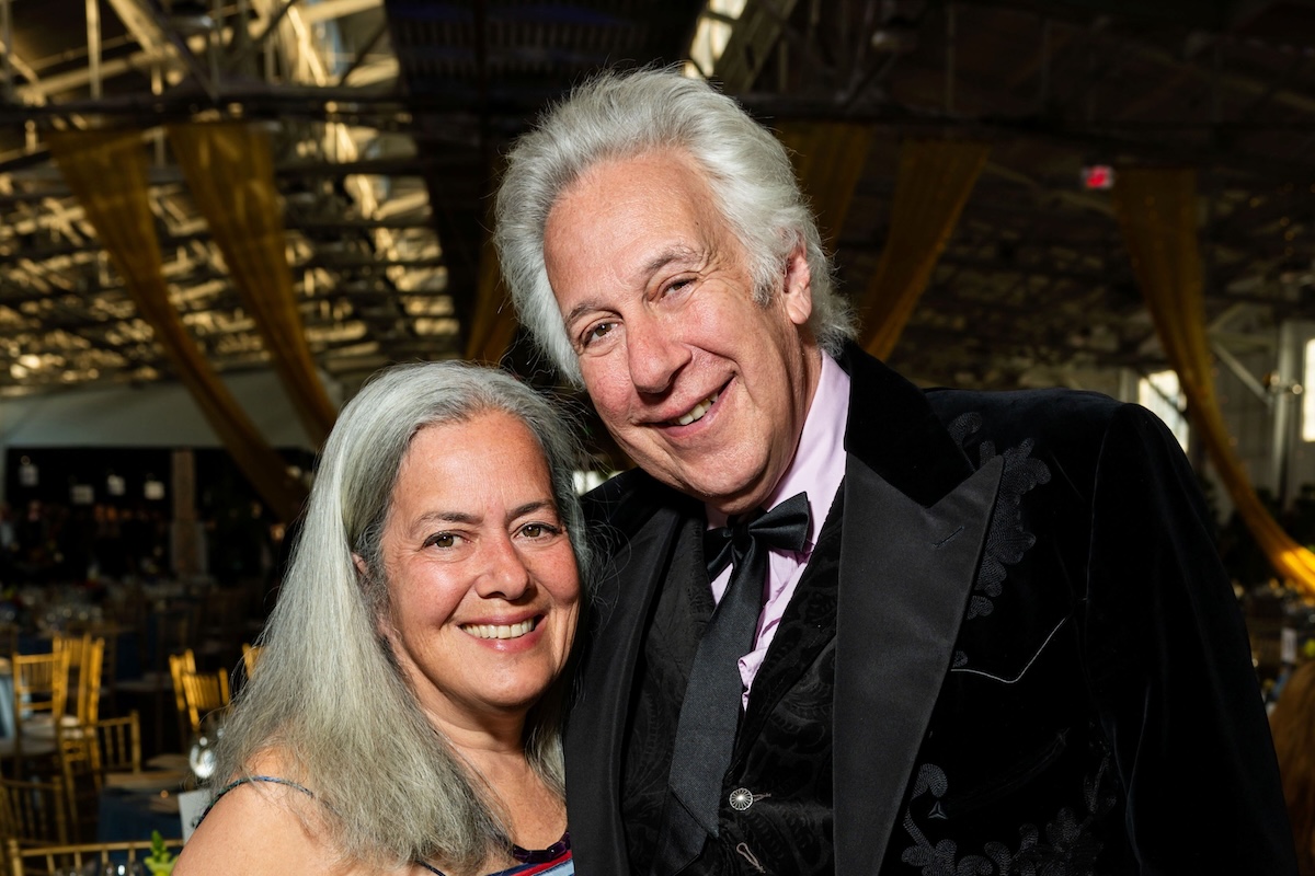A man and a woman pose for a picture.