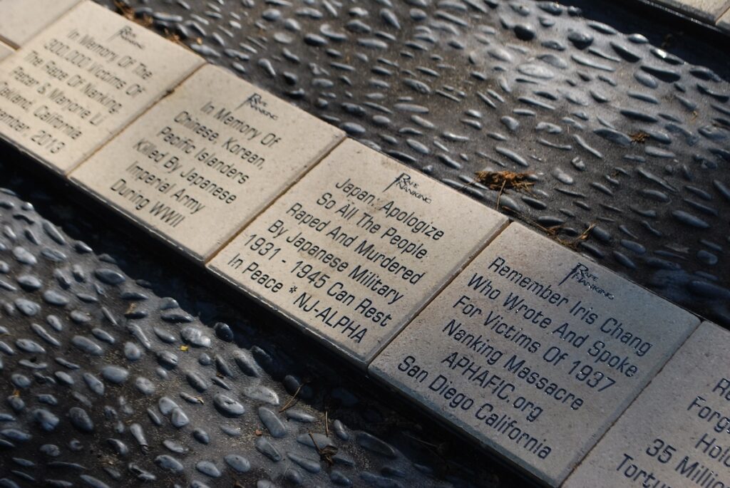 An up close shot of stone tiles engraved with writing.