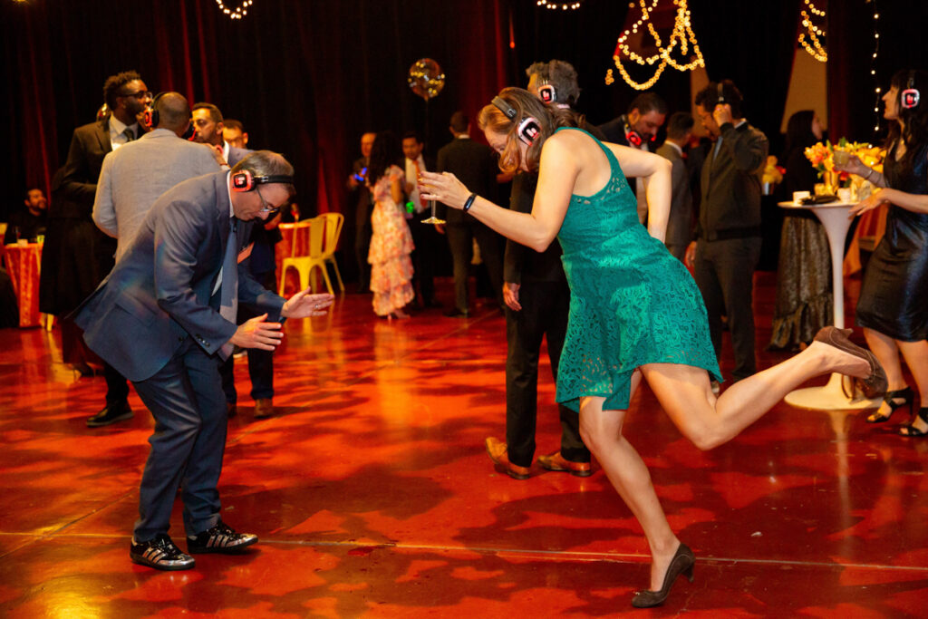 Two people dancing at a silent disco.