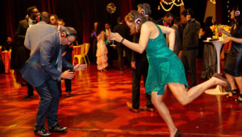 Two people dancing at a silent disco.
