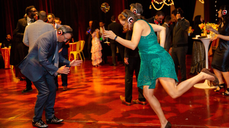 Two people dancing at a silent disco.