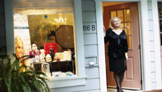Eva Claiborne standing in the doorway of her business