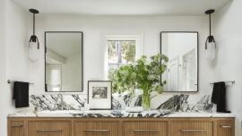 Modern Tiburon bathroom with wood vanity, marble countertop, mirrors.