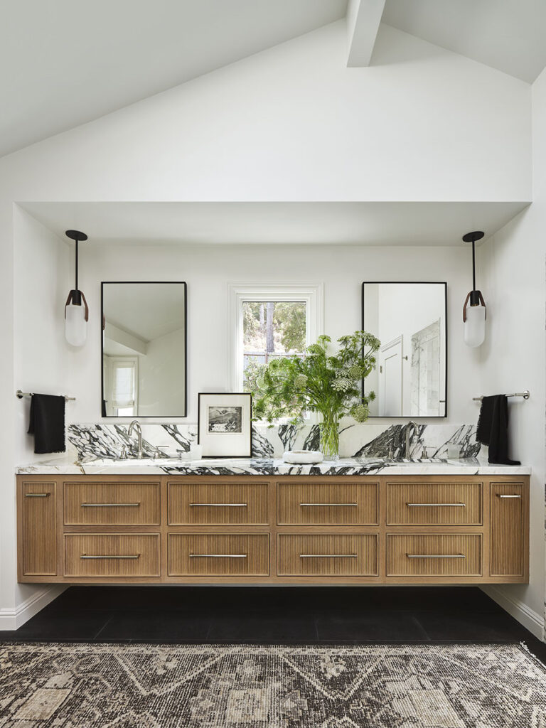 Modern Tiburon bathroom with wood vanity, marble countertop, mirrors.