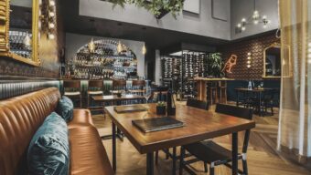 A wooden table in a rustic looking restaurant