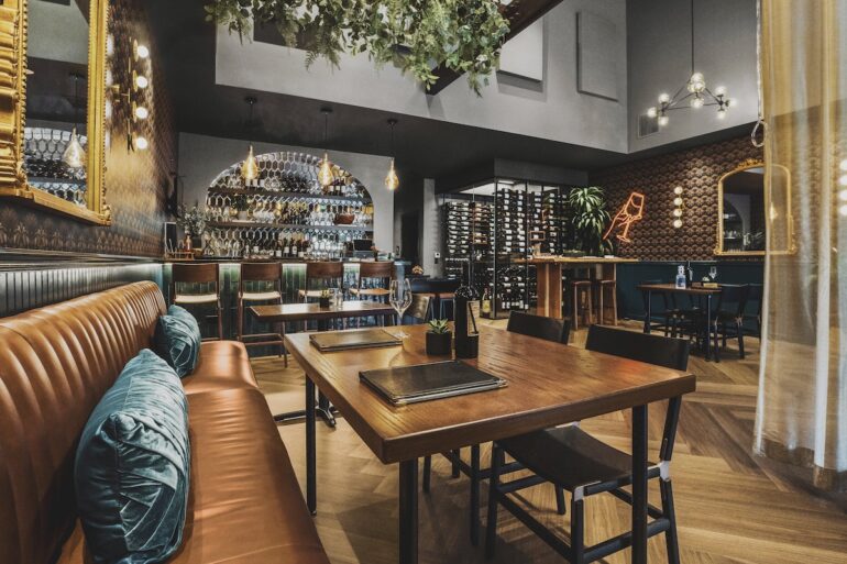 A wooden table in a rustic looking restaurant