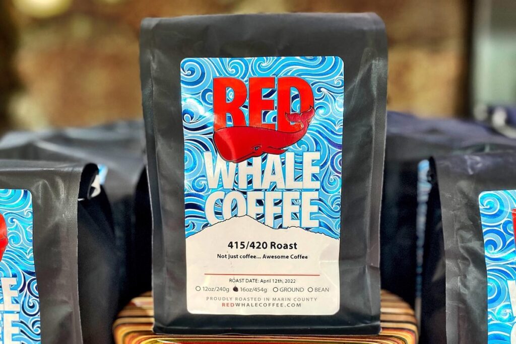 A bag of coffee with a logo that reads "Red Whale Coffee."