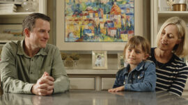 Mike, Courtney, and Kelsey Grady at a table during an interview