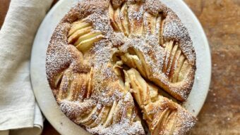 Sunken Pear Cake on round plate with pie spoon