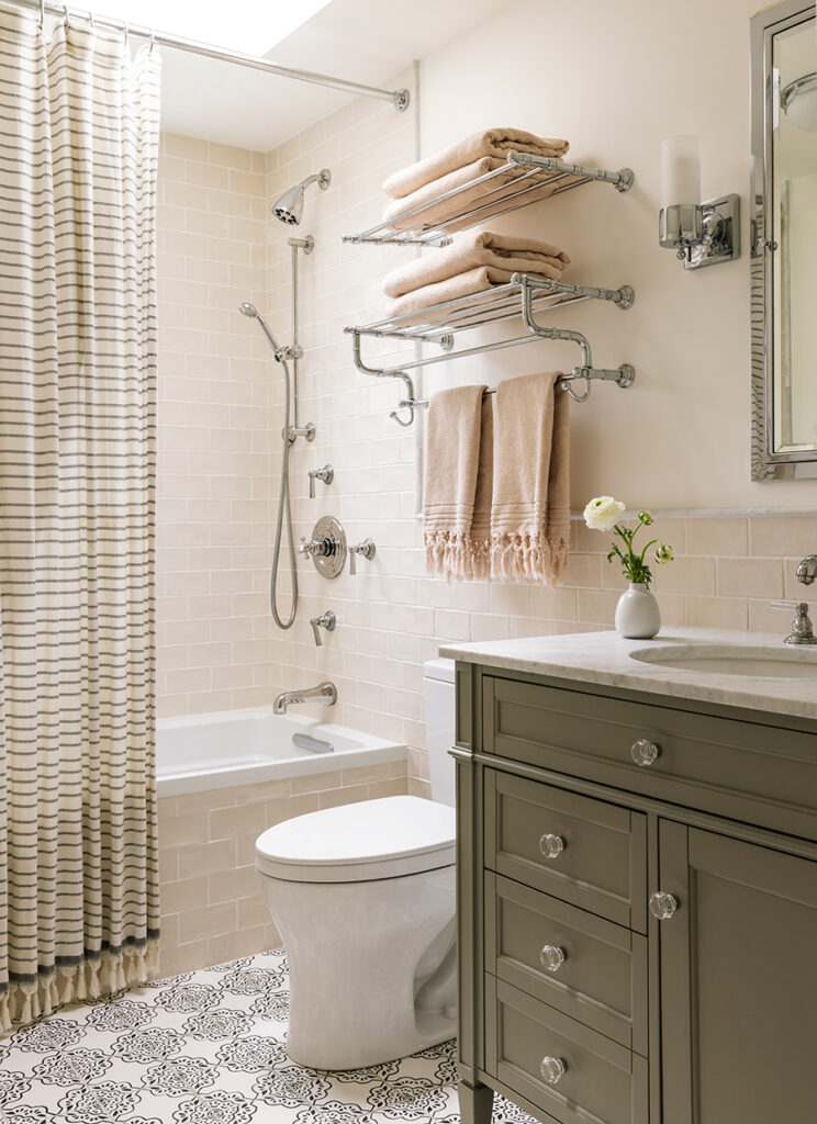 A modern bathroom layout including a shower, toilet, sink, and towel rack, emphasizing practicality and style.