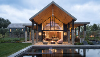 A contemporary home featuring a swimming pool and a spacious patio area for outdoor relaxation.