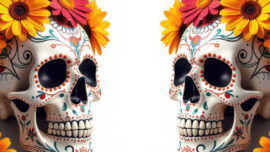 Two artistic sugar skulls embellished with flowers, celebrating the tradition of honoring deceased loved ones.
