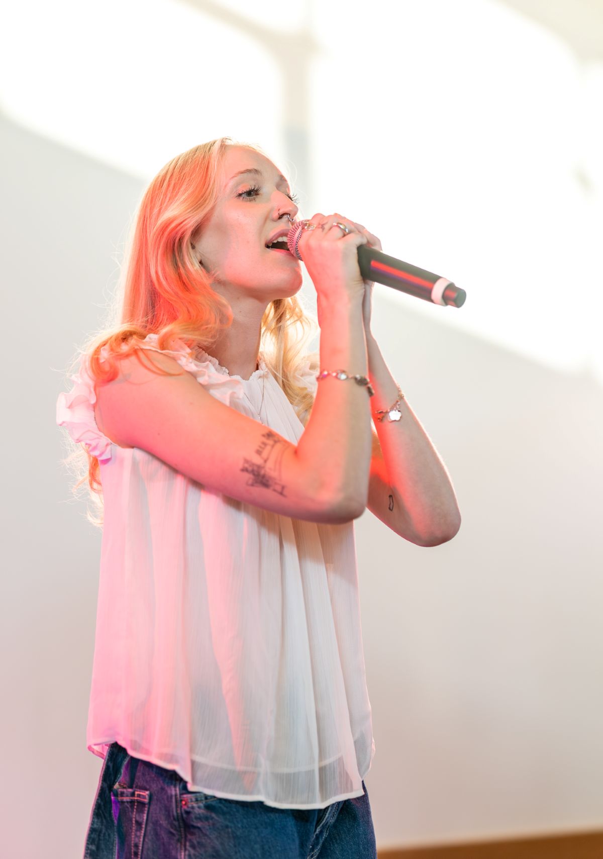 Performer singing under bright lights at Marin Best of the County 2025.