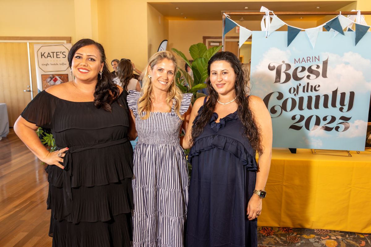 Three women standing in front of Best of the County 2025 sign at Marin Magazine event.