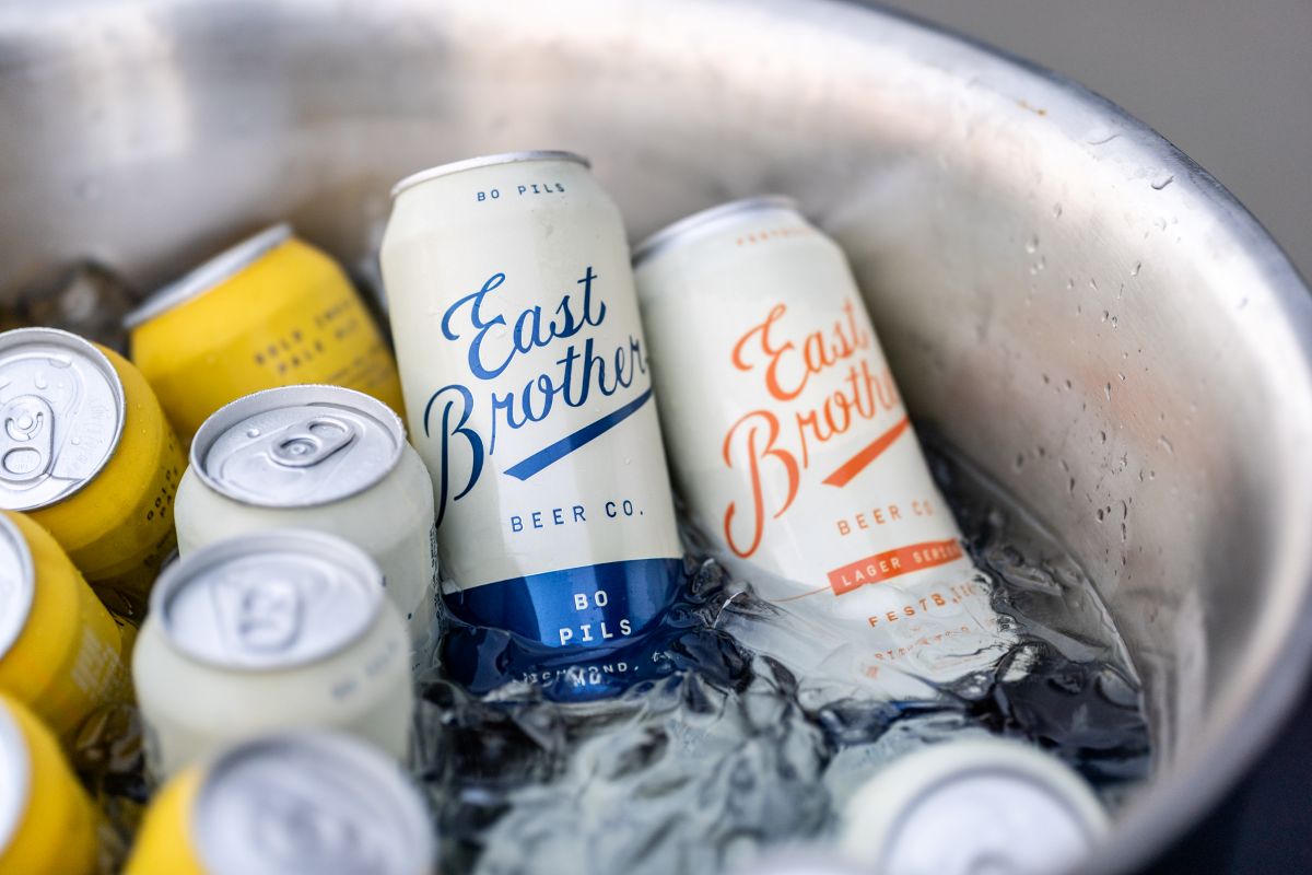 East Brother beer cans chilled in ice bucket.