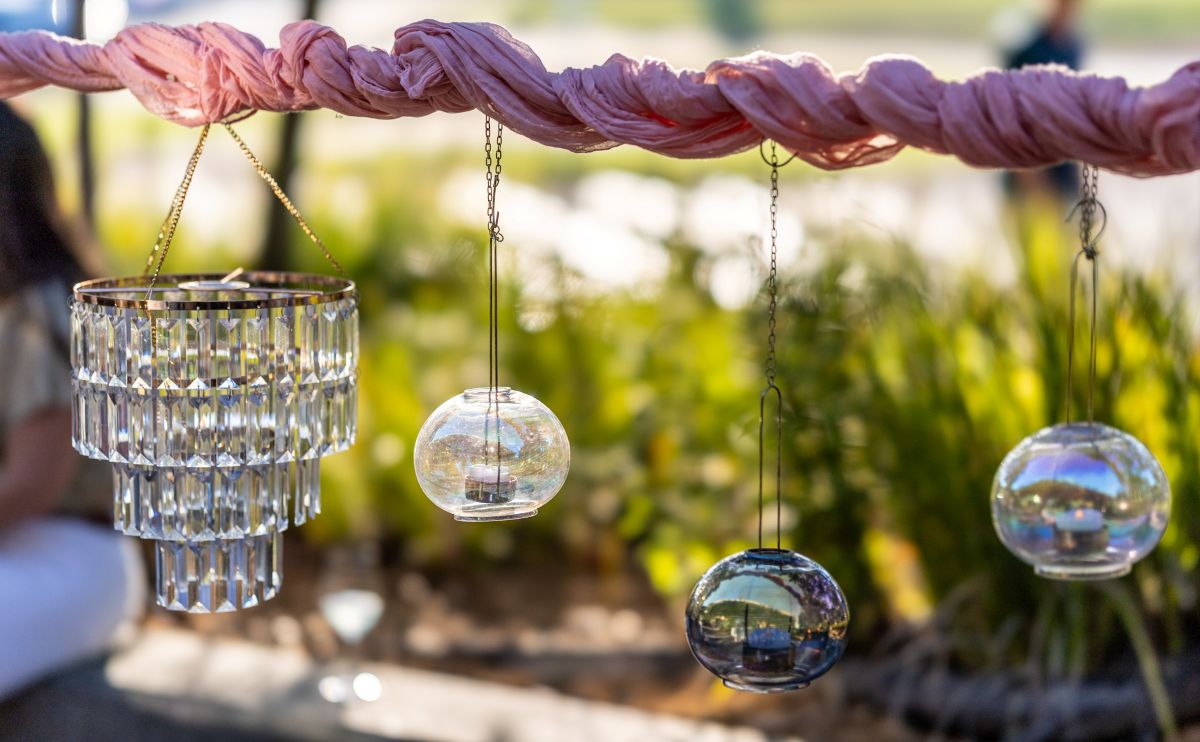 Hanging crystal chandelier and glass candle holders.