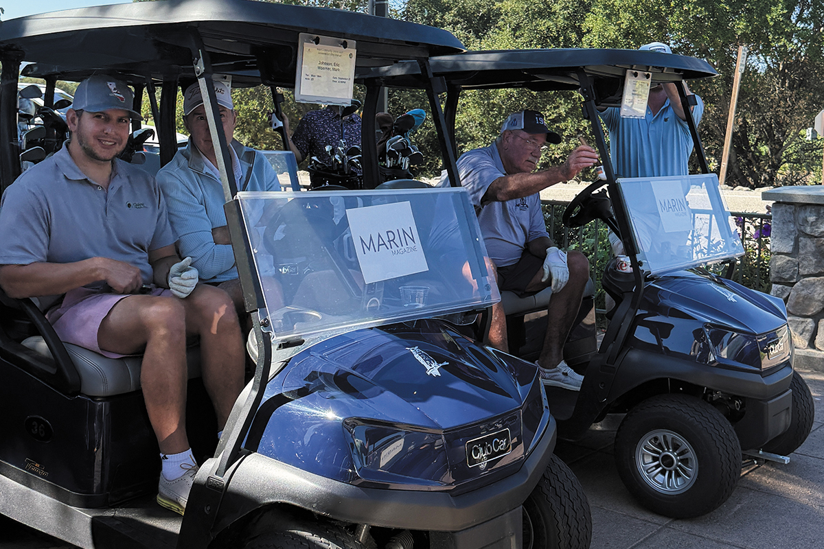 A group of men in golf carts
