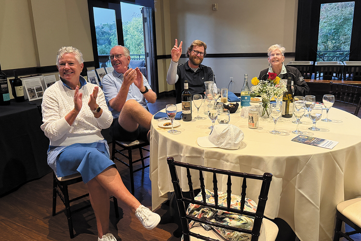 A group of people sitting at a dinner table