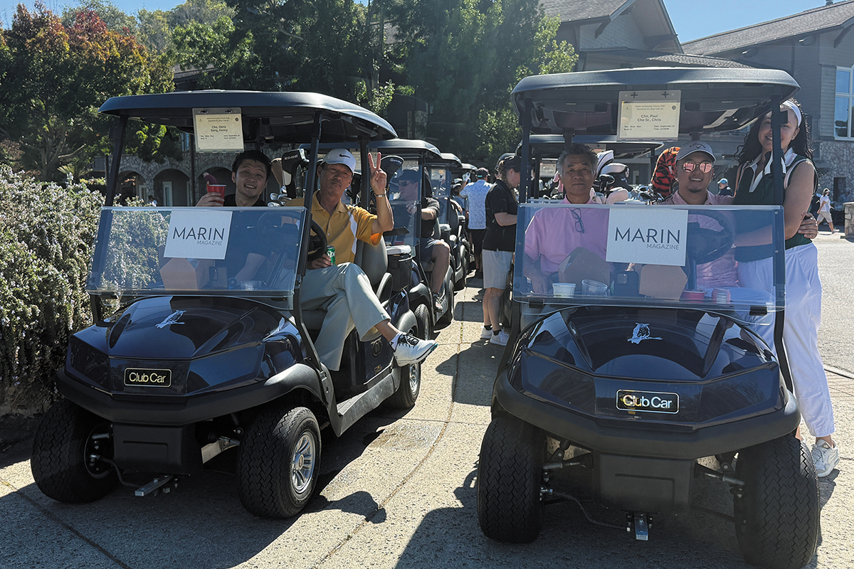 Men and women in golf carts