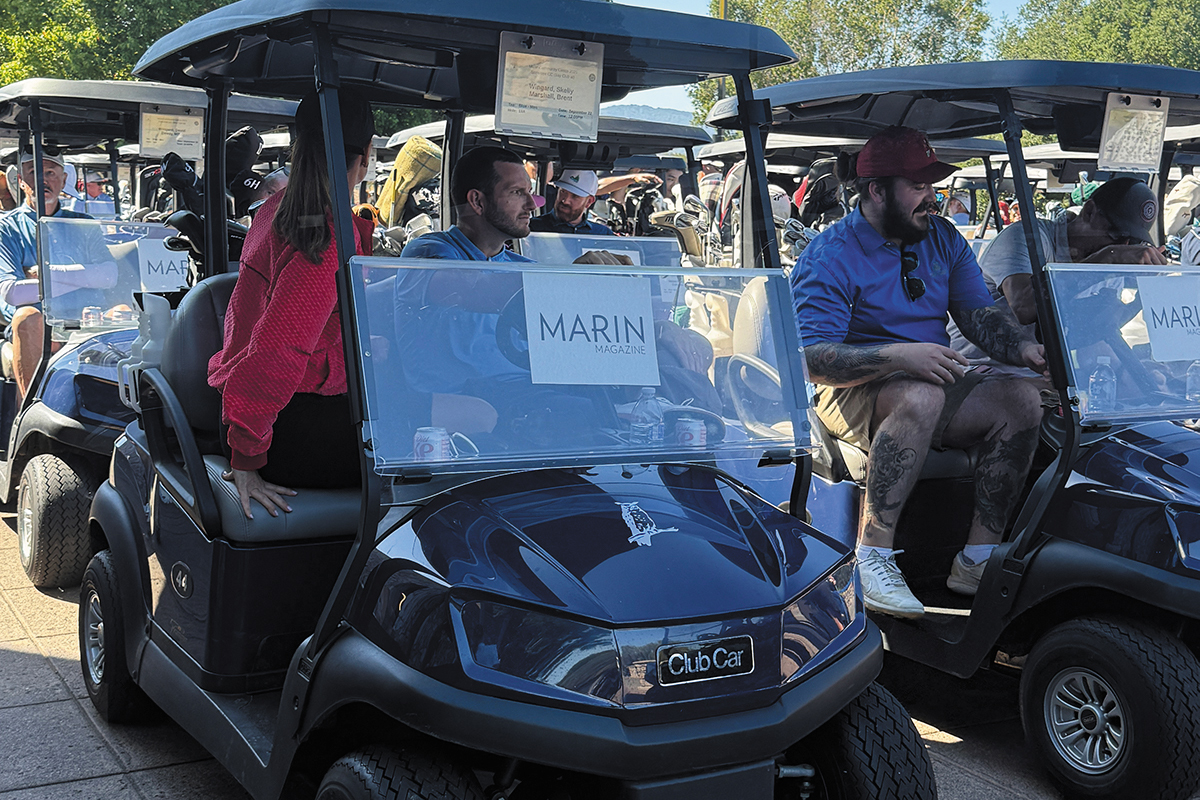 Men and women in golf carts